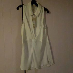 White no sleeve shirt.